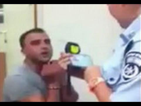 Israeli Man Goes Nuts After Being Detained By Police For DUI (Repeatedly Bangs His Head On Wall) .